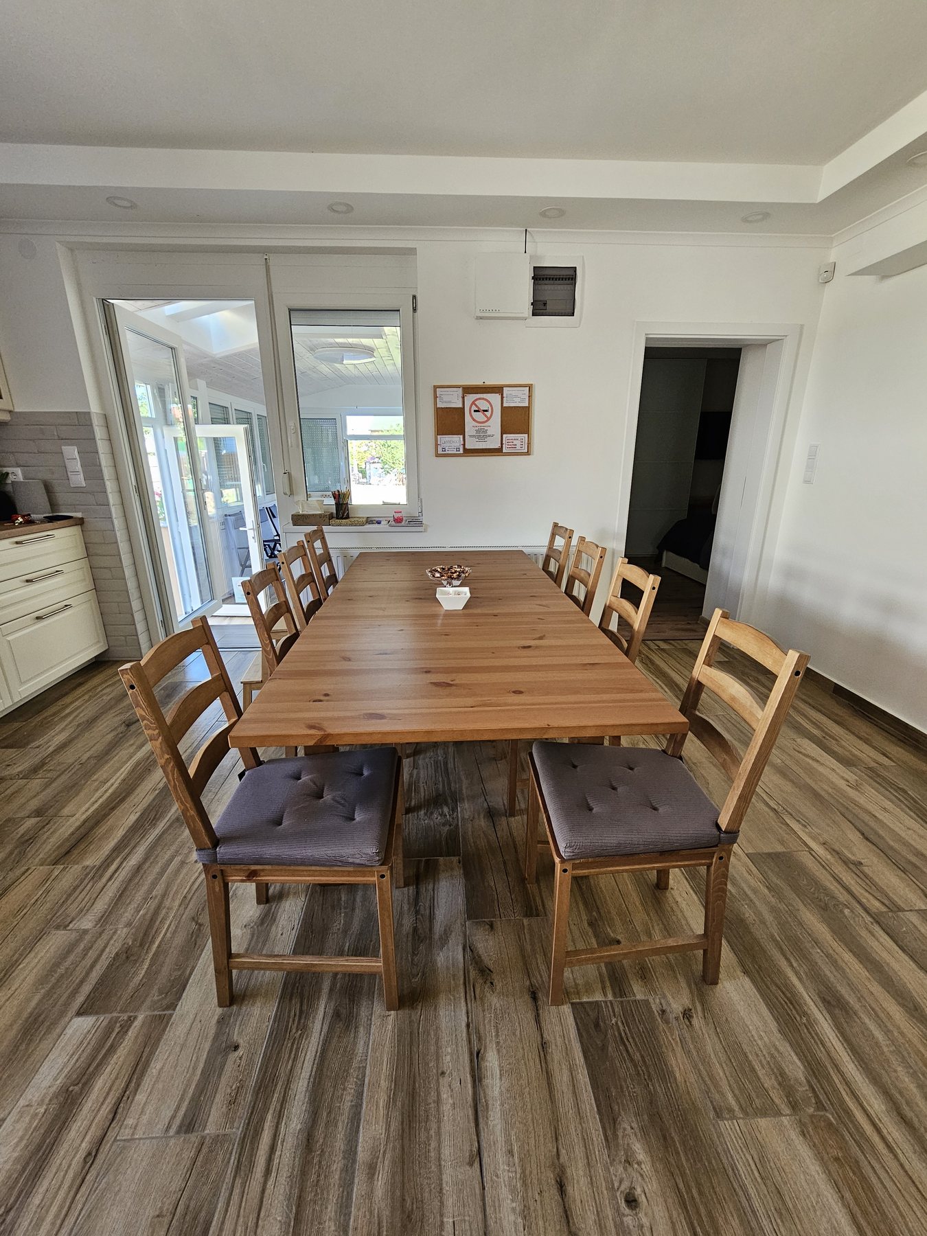 Large wooden dining table with seating for eight