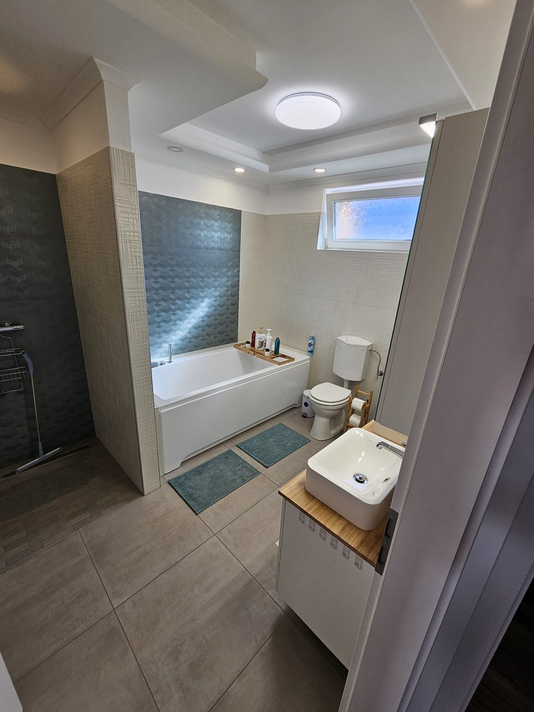Spacious bathroom with shower and bath