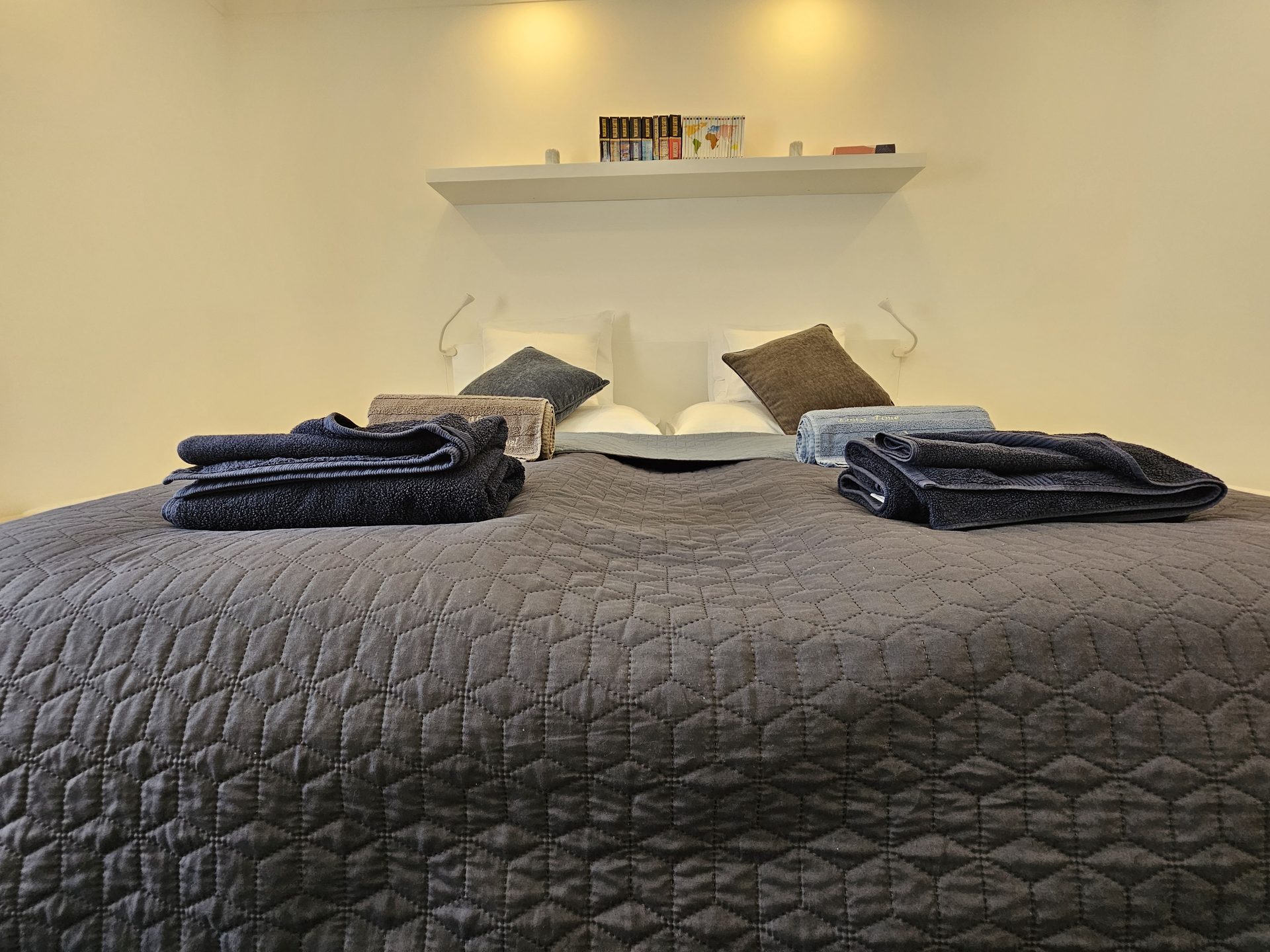 Bedroom one with provided towels